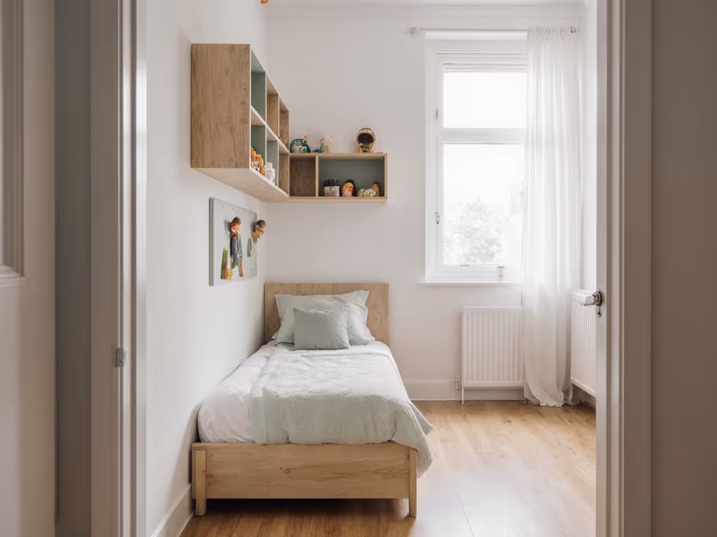 urban_toddler_bedroom_with_low-profile_bed_clear_floor_paths_and_wall-secured_furniture